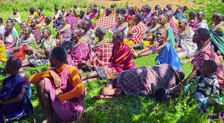 Women of Samburu County gathered for GDP Day of Hope and Help — colorful traditional dress, Northern Kenya