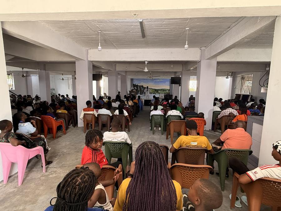 GDP Multiplex Center auditorium — colorful plastic chairs set up ready for conference, Mombasa Kenya