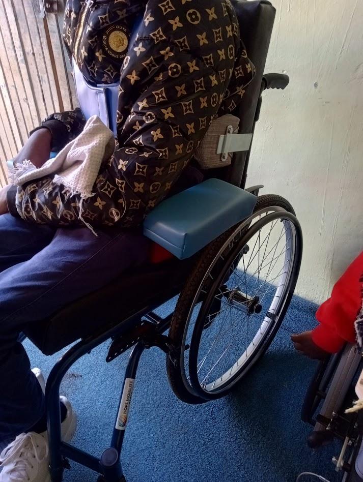 Child in wheelchair at Project of Hope Special Needs Center Mathare Nairobi — GDP Kenya daily care and therapy